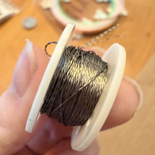 Here I had the conductive thread I wanted to try using on the glove as a way to avoid the messy copper/fabric combo.